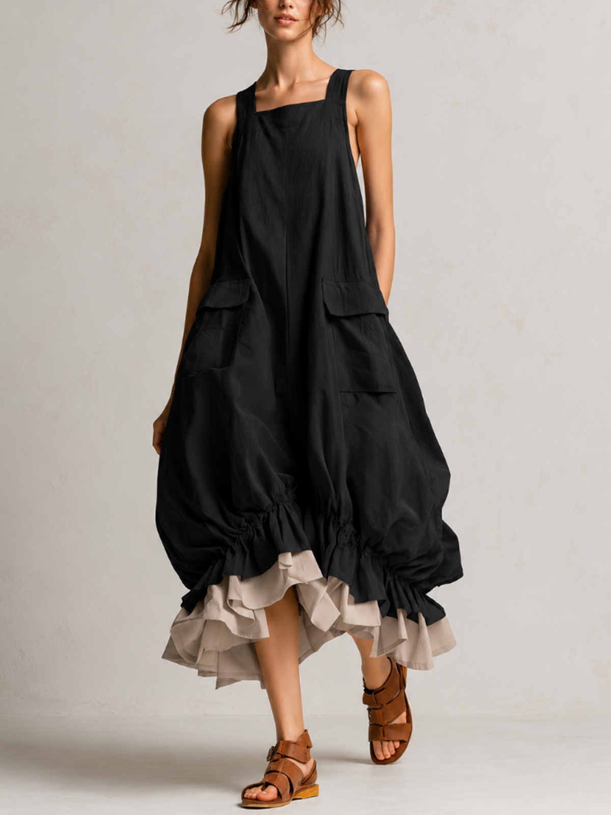 Vestido midi globo negro sin mangas con bolsillos grandes y volantes en capas
