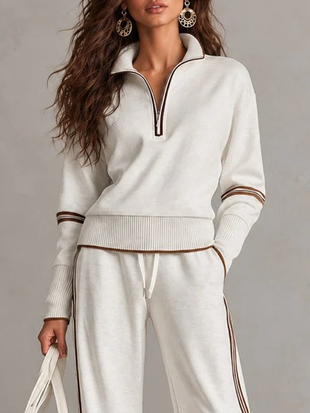 Conjunto de sudadera acanalada blanca con media cremallera y pantalón ancho con bloques de color