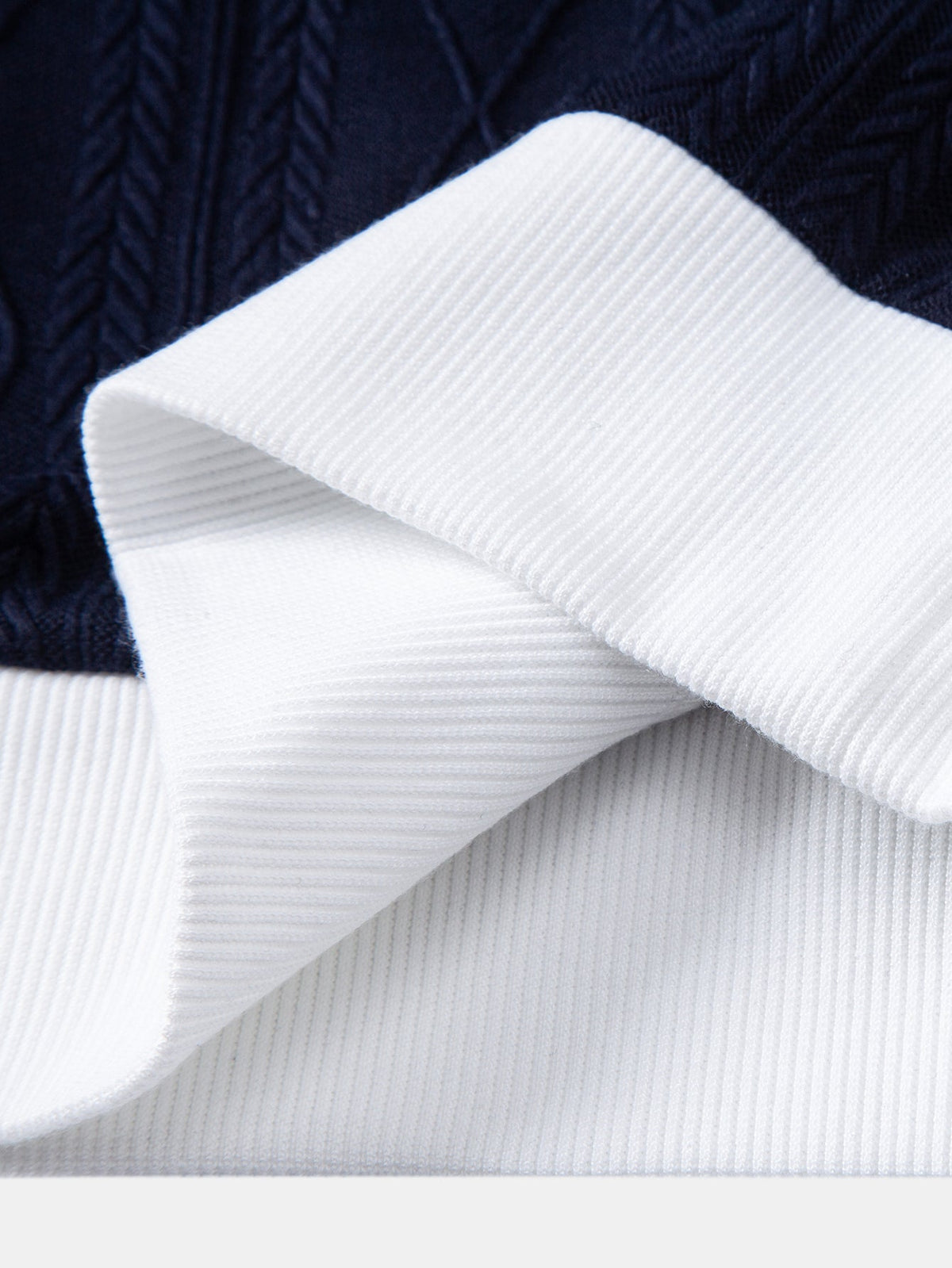 Polo de punto jacquard con geometría de contraste