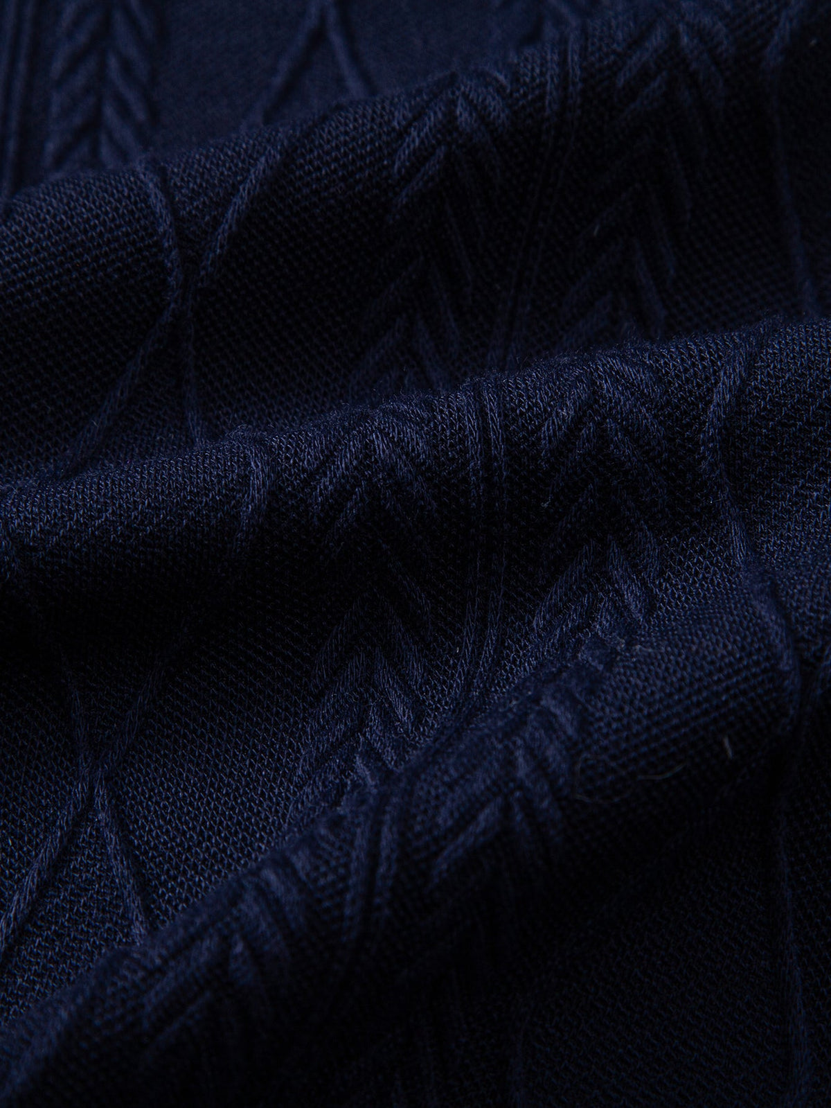 Polo de punto jacquard con geometría de contraste