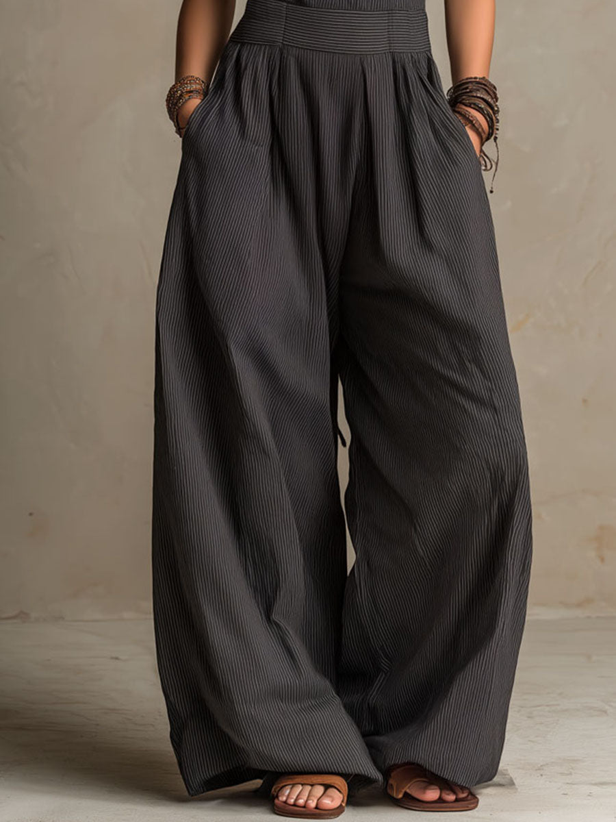 Mono bohemio gris marengo de raya diplomática, cuello halter y espalda cruzada