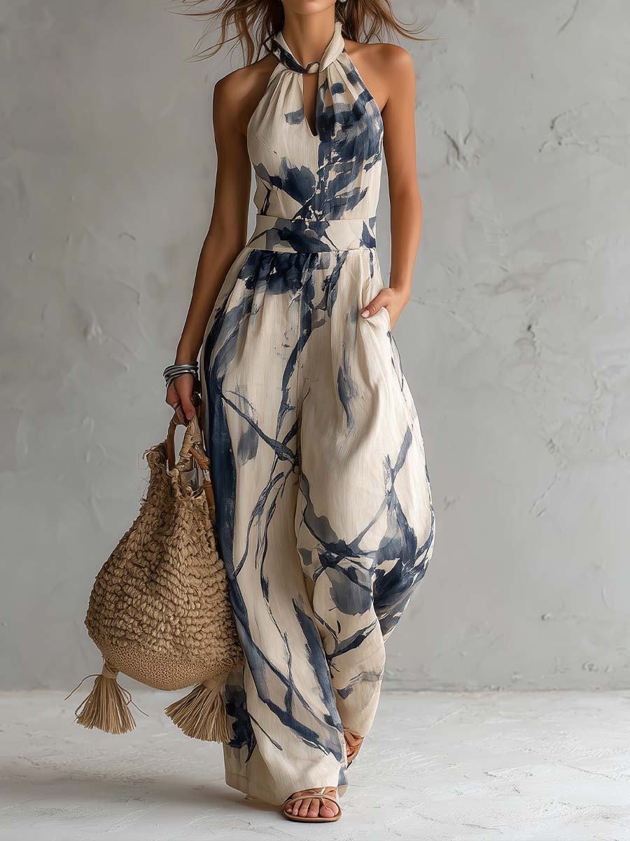 Mono con cuello halter, estampado efecto tinta, pierna ancha y bolsillos