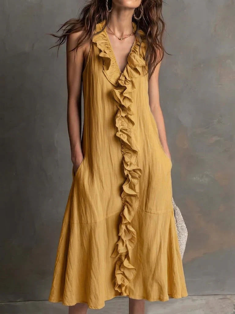 Vestido liso sin mangas con escote en pico y falda de vuelo con volantes