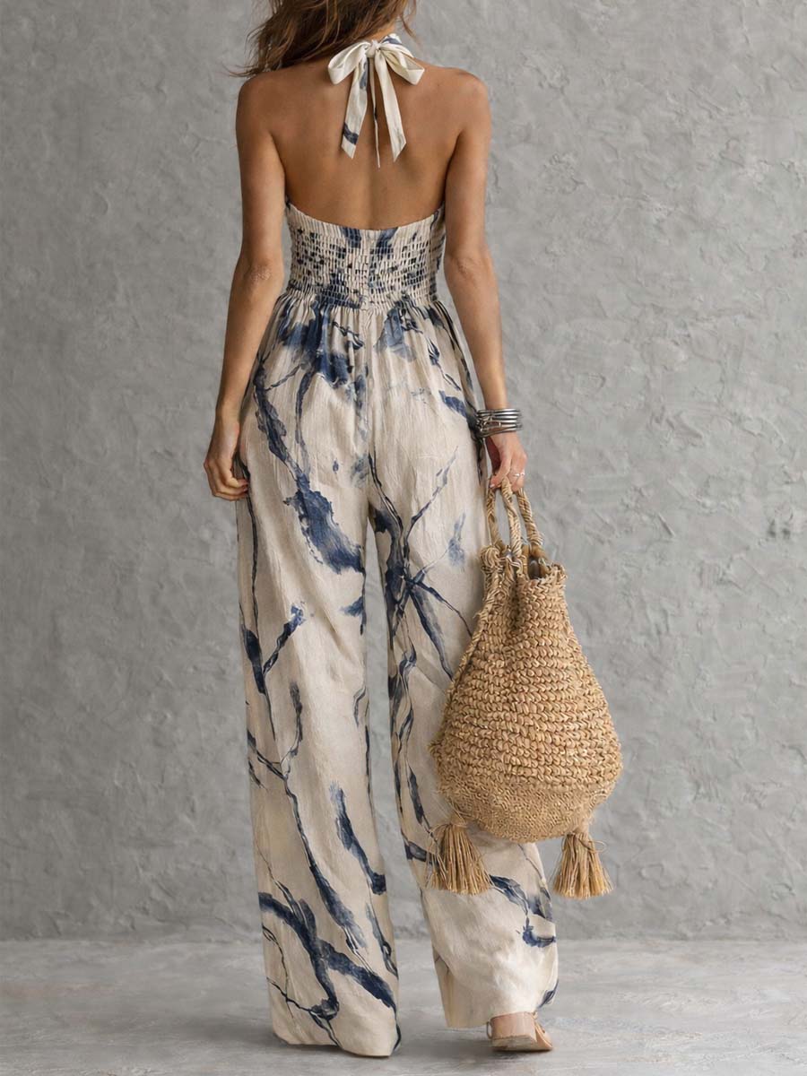 Mono con cuello halter, estampado efecto tinta, pierna ancha y bolsillos