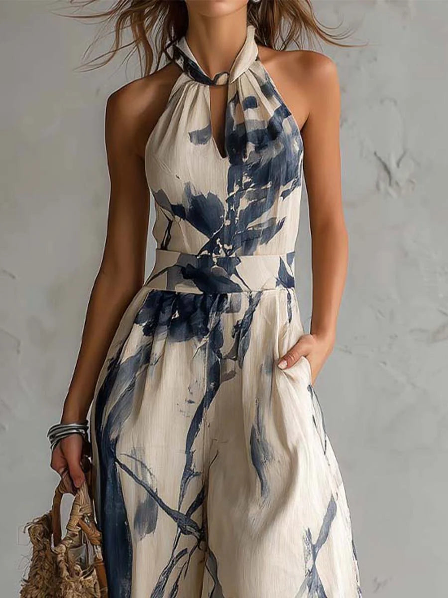 Mono con cuello halter, estampado efecto tinta, pierna ancha y bolsillos