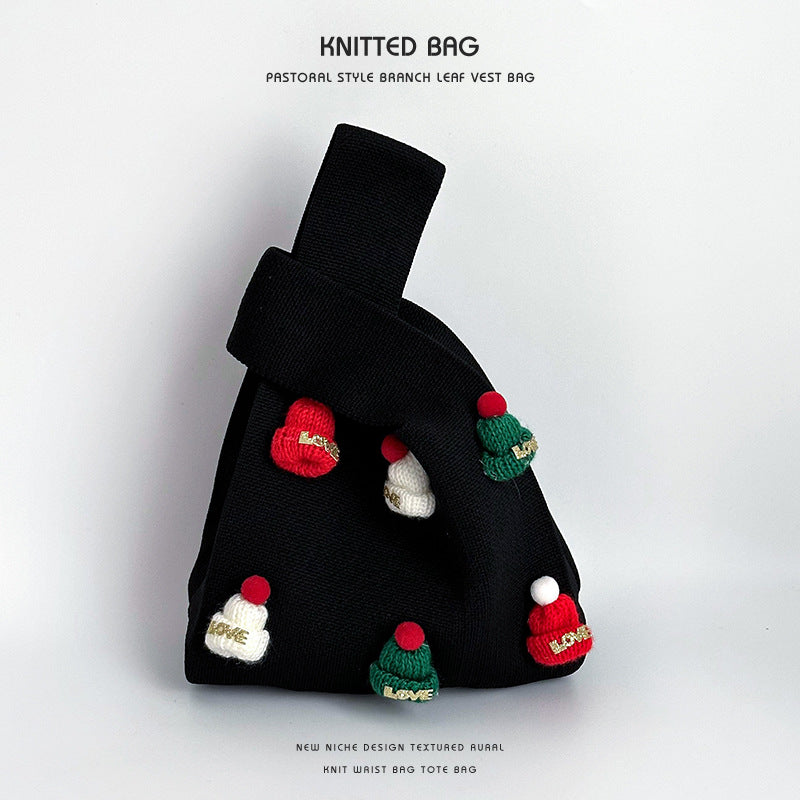 Bolso de punto artesanal con gorro navideño