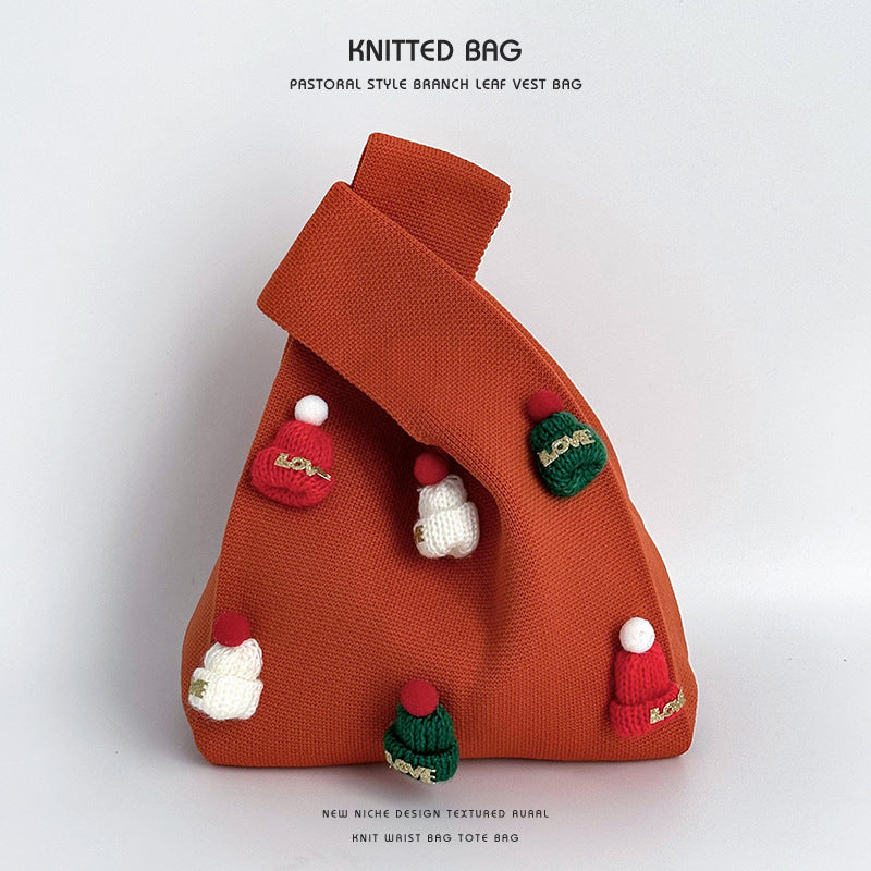 Bolso de punto artesanal con gorro navideño