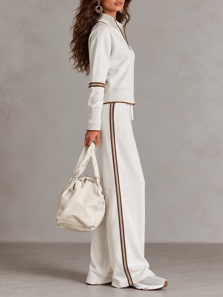 Conjunto de sudadera acanalada blanca con media cremallera y pantalón ancho con bloques de color
