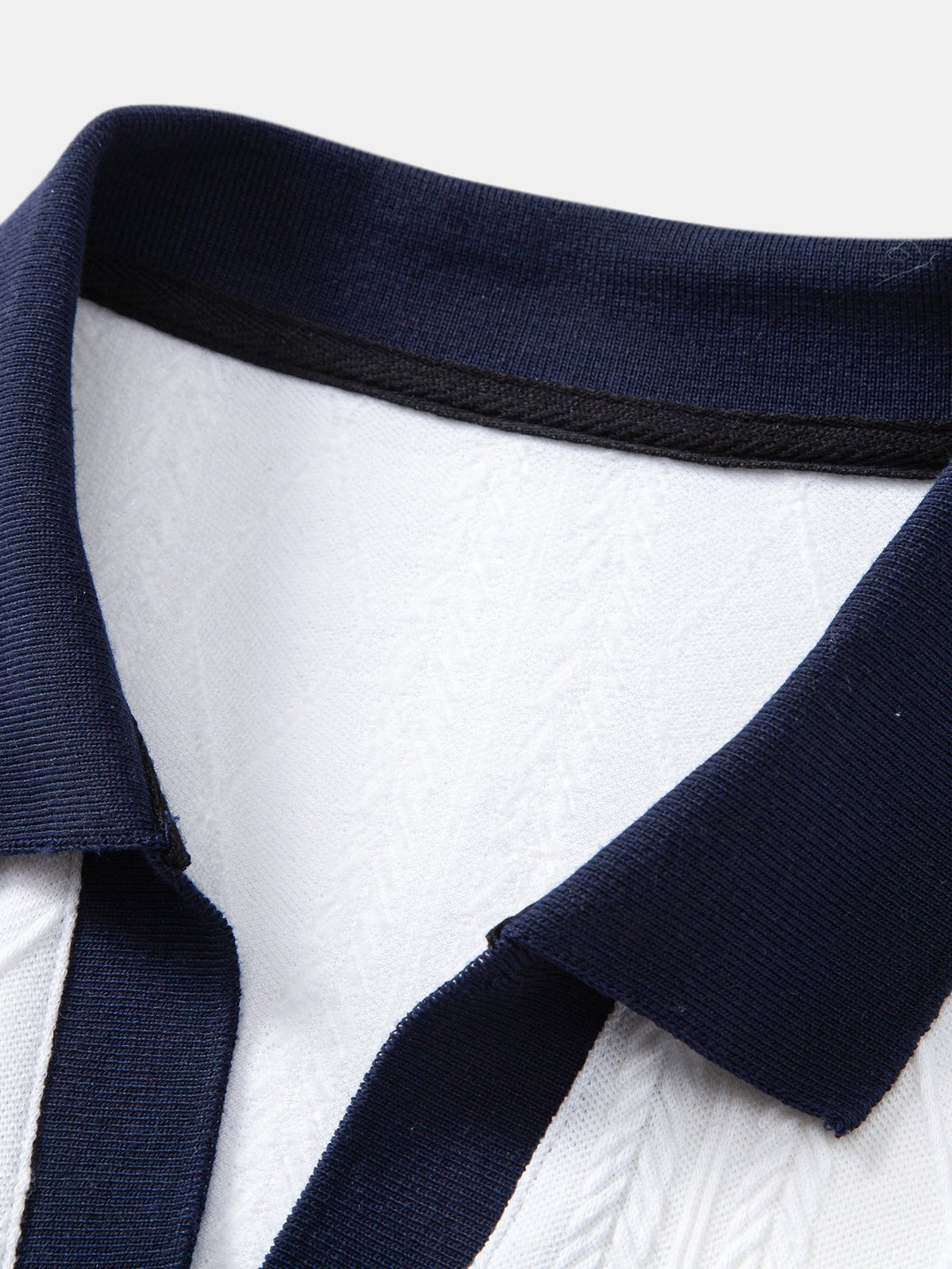 Polo de punto jacquard con geometría de contraste