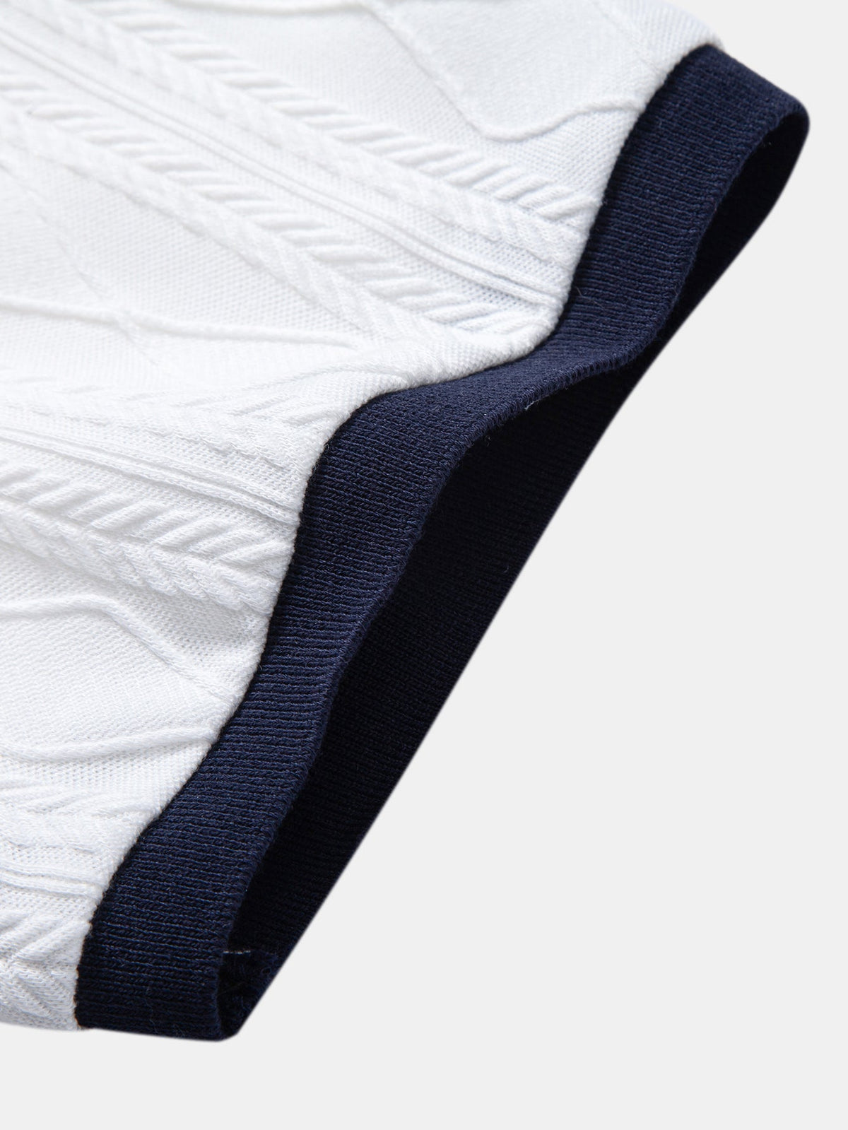 Polo de punto jacquard con geometría de contraste
