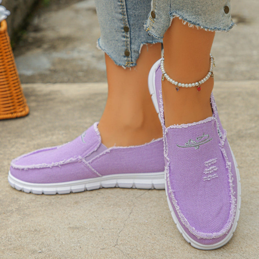 Mocasines de lona desgastada con bordado, sin cordones