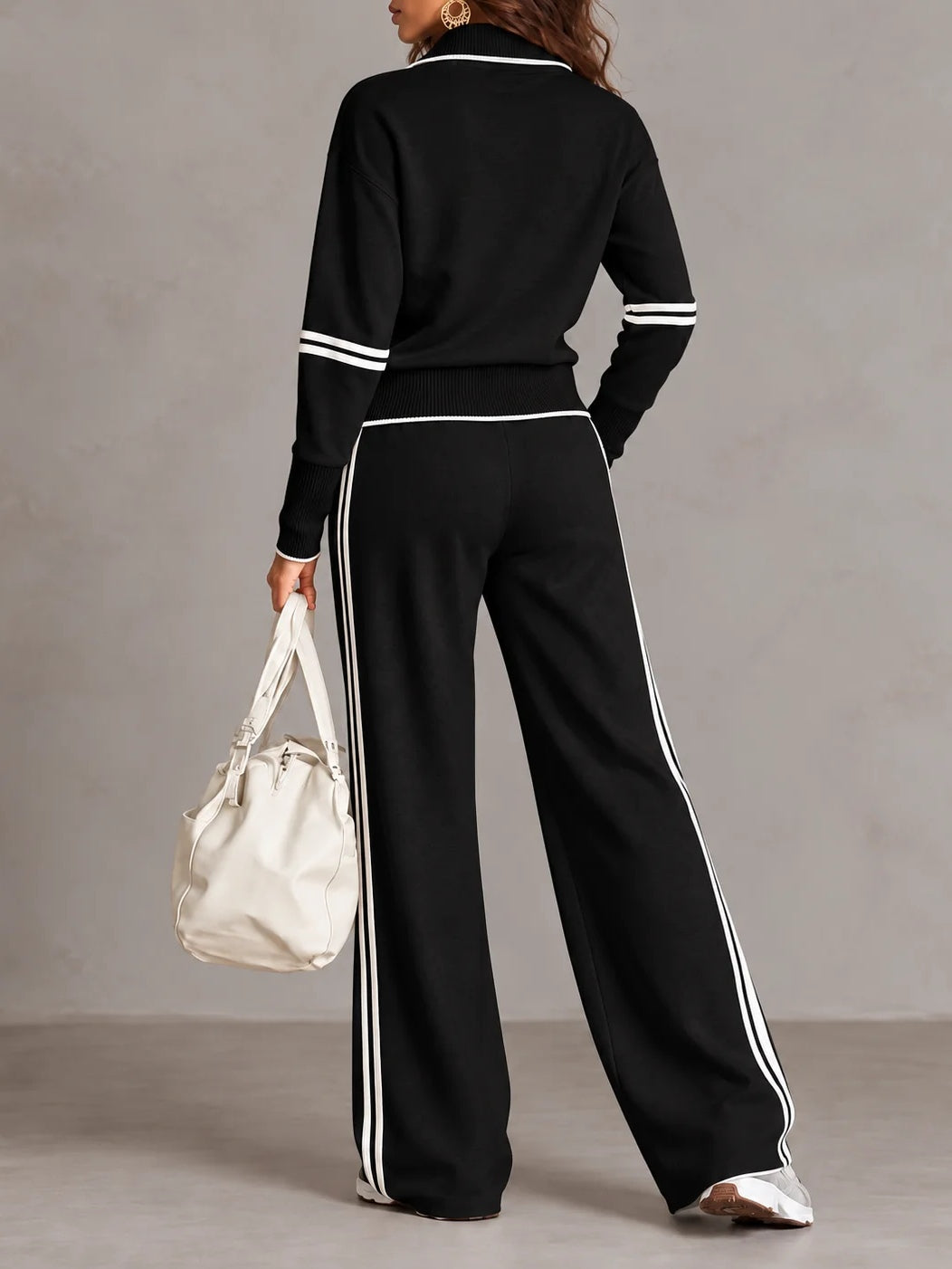 Conjunto de sudadera acanalada blanca con media cremallera y pantalón ancho con bloques de color