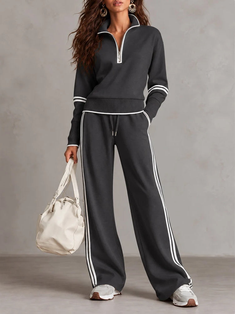 Conjunto de sudadera acanalada blanca con media cremallera y pantalón ancho con bloques de color